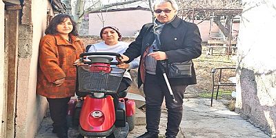 KİGDER'den şiddet mağduru kadına akülü araç desteği